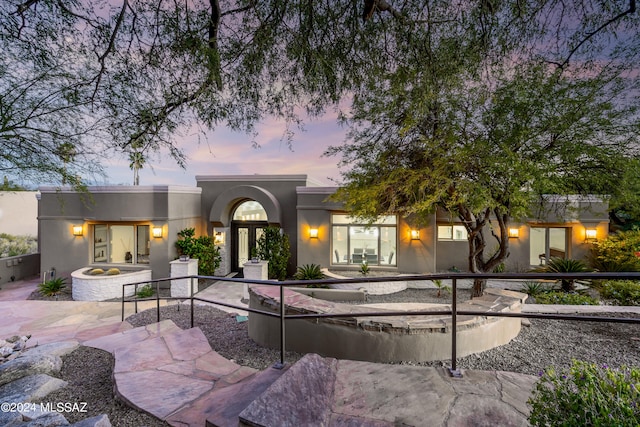 view of front of home with a patio