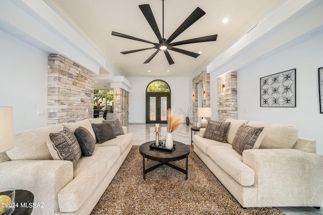 living room featuring ornamental molding, ceiling fan, and french doors