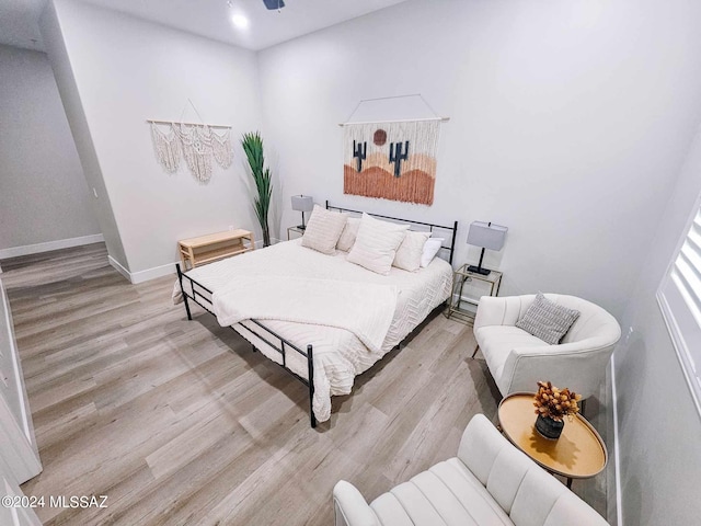 bedroom with light hardwood / wood-style floors