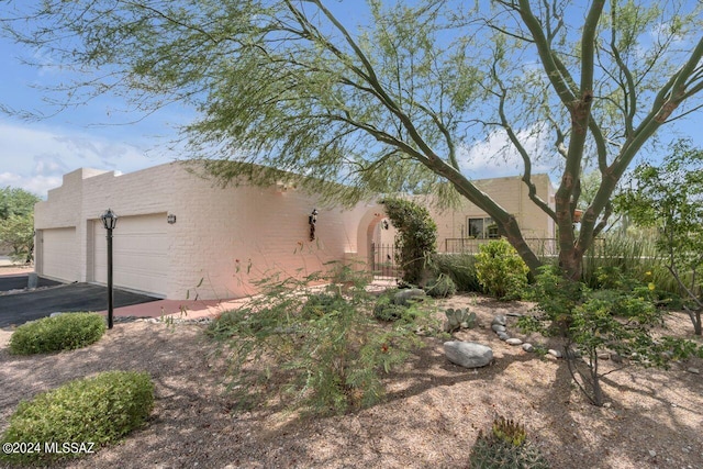 view of property exterior with a garage