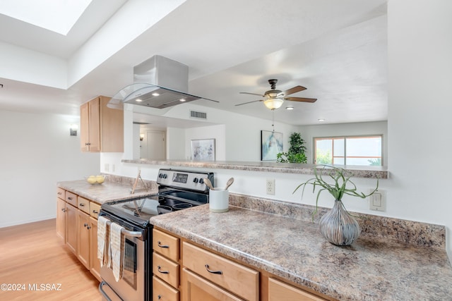 kitchen with light hardwood / wood-style flooring, light brown cabinetry, electric stove, and island range hood