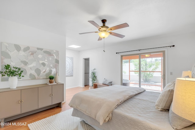 bedroom with access to exterior, ceiling fan, and light wood-type flooring