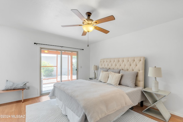 bedroom featuring wood-type flooring, access to exterior, and ceiling fan