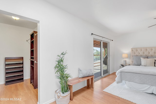 bedroom featuring light hardwood / wood-style floors and access to exterior