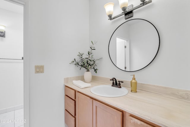 bathroom with tile patterned flooring and vanity