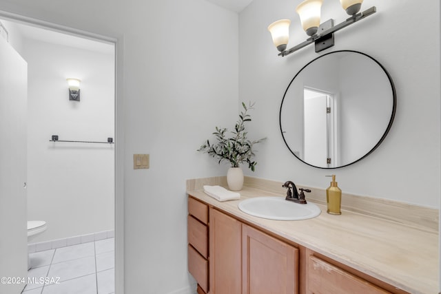 bathroom featuring vanity, tile patterned flooring, and toilet