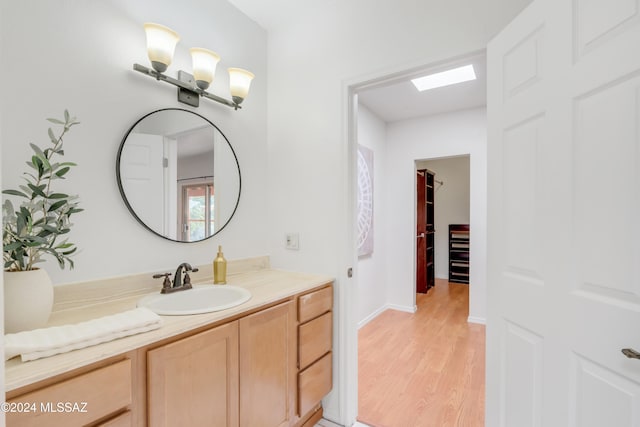 bathroom featuring vanity and hardwood / wood-style floors