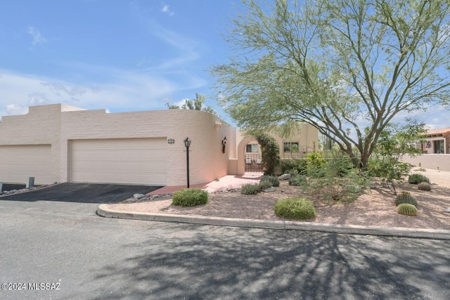 adobe home featuring a garage