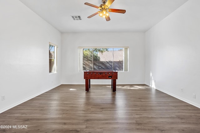 playroom featuring dark hardwood / wood-style flooring and ceiling fan