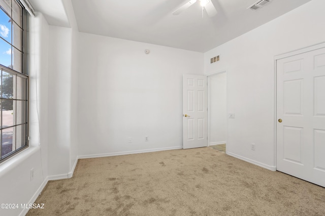 spare room with light colored carpet