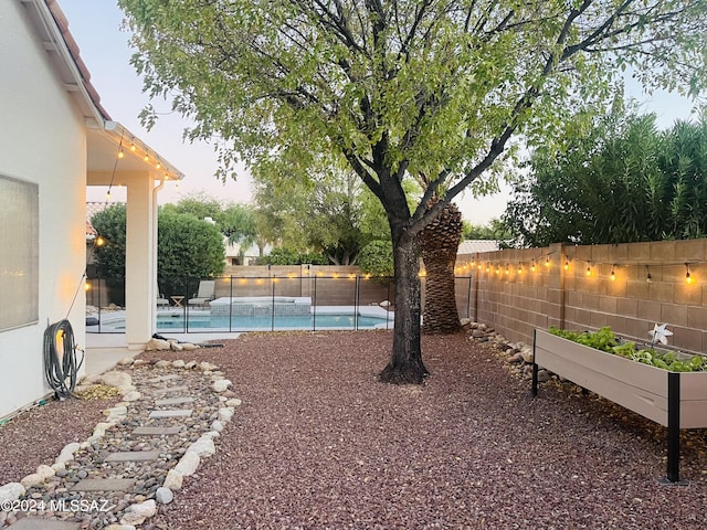 view of yard featuring a fenced in pool