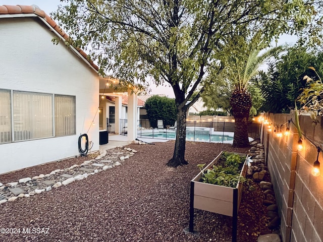 view of yard featuring a fenced in pool