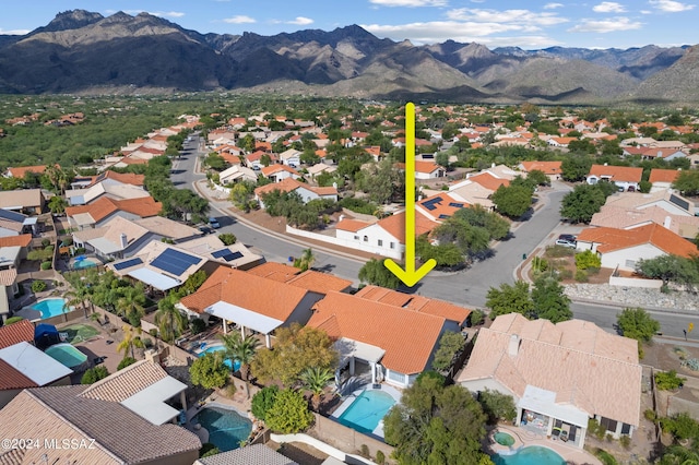 drone / aerial view featuring a mountain view