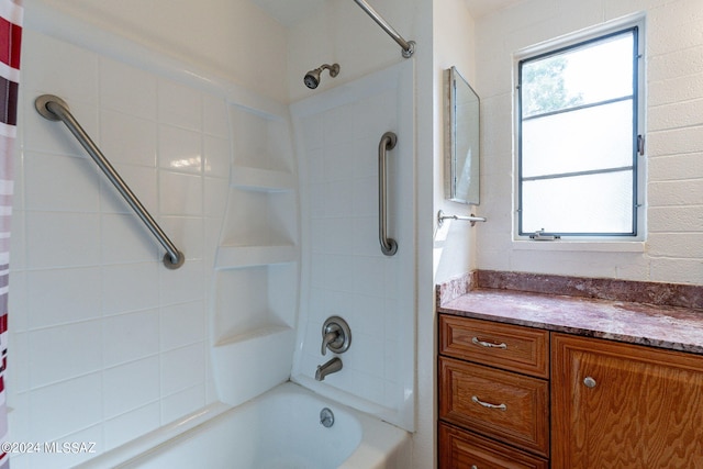 bathroom featuring shower / bath combo and vanity