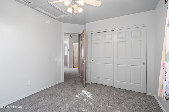 unfurnished bedroom featuring a closet, carpet, and ceiling fan