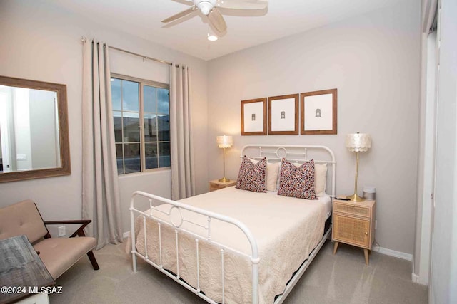 bedroom featuring carpet floors, a ceiling fan, and baseboards