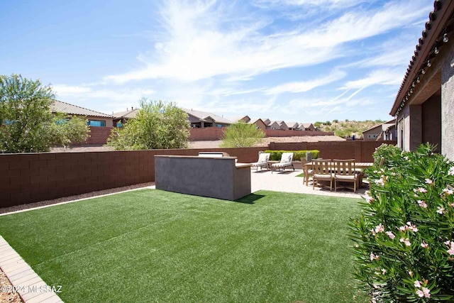 view of yard with an outdoor living space, a fenced backyard, a residential view, and a patio
