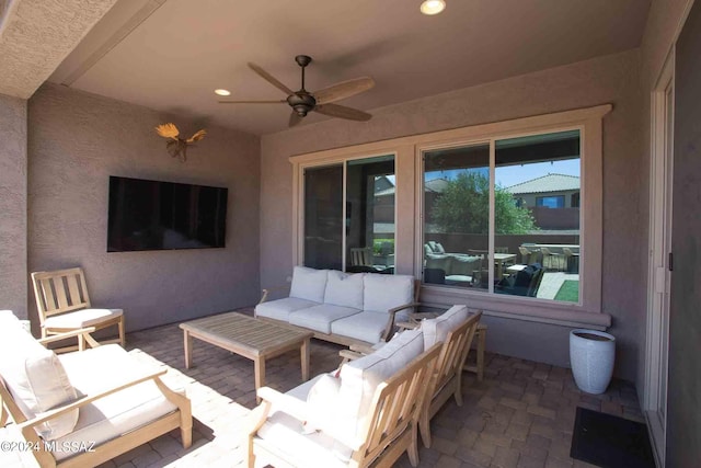 view of patio with outdoor lounge area and ceiling fan