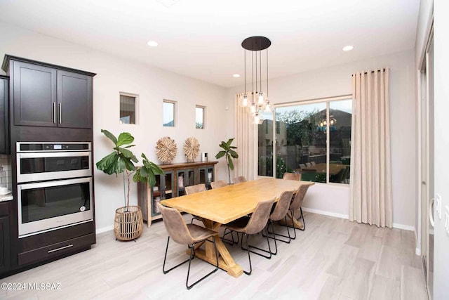 dining area with recessed lighting, light wood-type flooring, and baseboards
