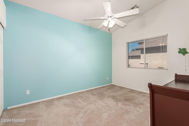 unfurnished bedroom with visible vents, baseboards, ceiling fan, carpet floors, and vaulted ceiling