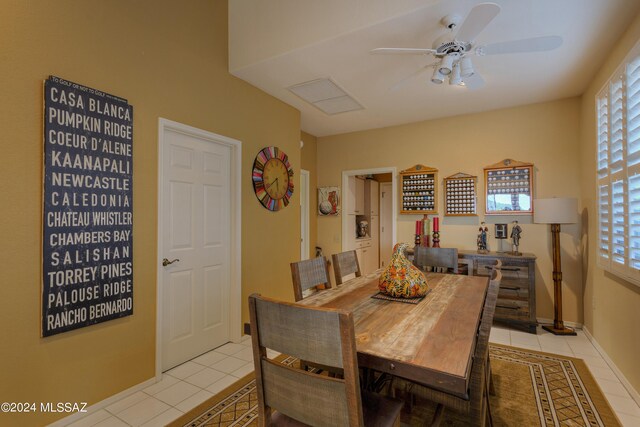 dining room featuring ceiling fan and light tile patterned flooring