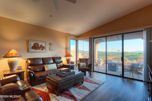 living room with ceiling fan, hardwood / wood-style flooring, lofted ceiling, and a healthy amount of sunlight