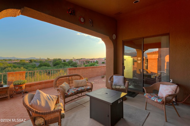 patio terrace at dusk with an outdoor hangout area