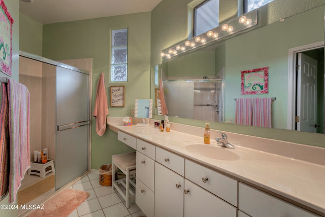 bathroom featuring vanity, an enclosed shower, and tile patterned floors