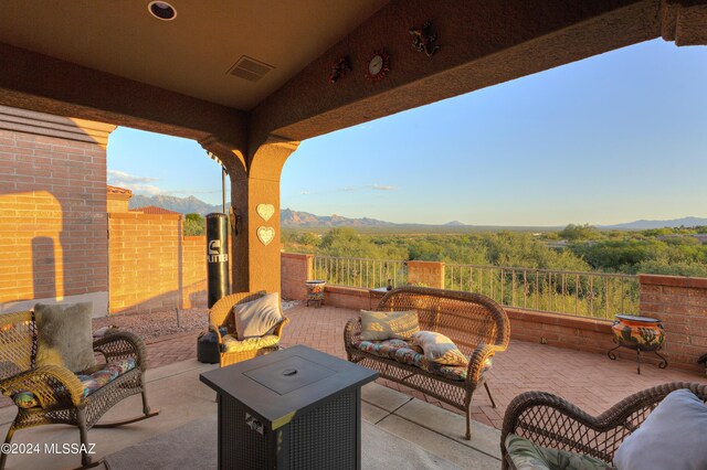 view of patio with a mountain view and outdoor lounge area