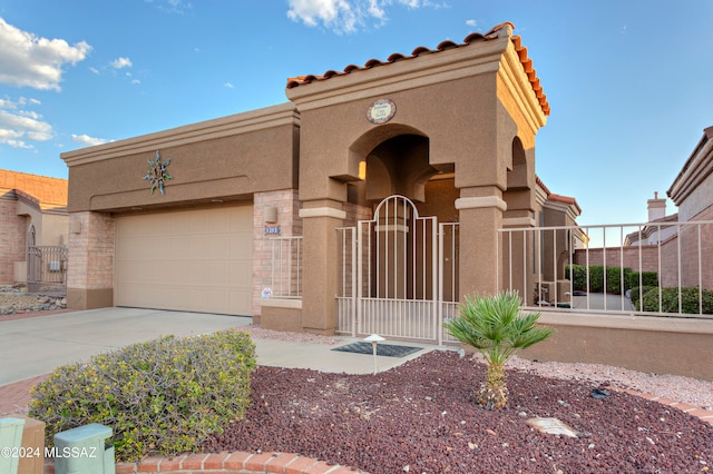 view of front of property with a garage