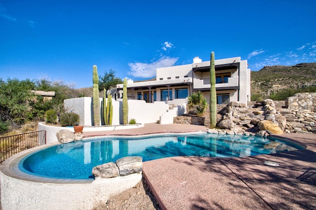 view of swimming pool featuring fence and a fenced in pool