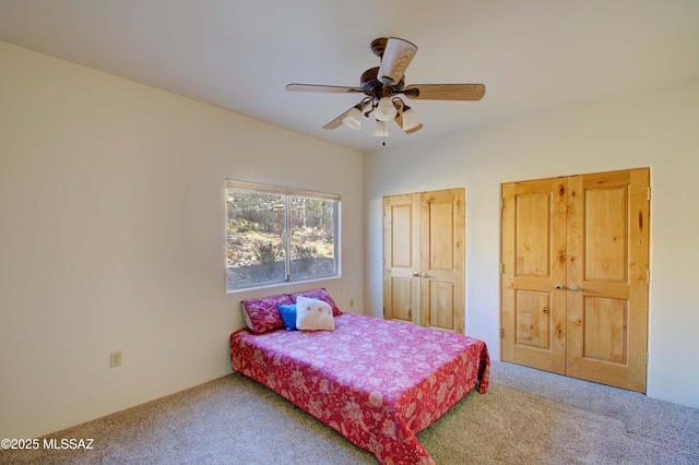 carpeted bedroom with ceiling fan