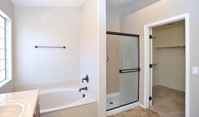 bathroom with separate shower and tub and vanity