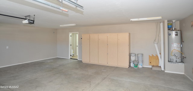 garage featuring gas water heater and a garage door opener