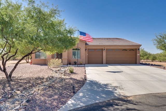 view of front of property with a garage