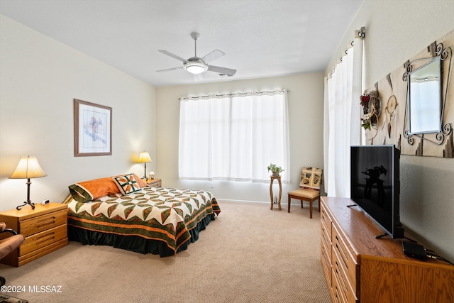 bedroom with light carpet and ceiling fan