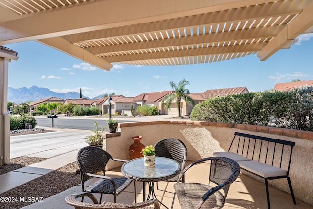 view of patio featuring a pergola and a mountain view
