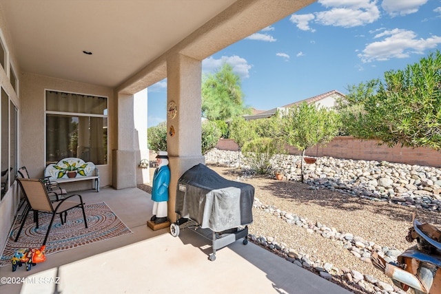 view of patio featuring a grill