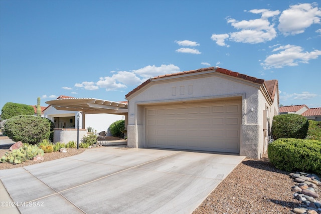 view of front of house with a pergola, a garage, stucco siding, a tile roof, and concrete driveway