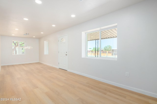 spare room with light wood-type flooring