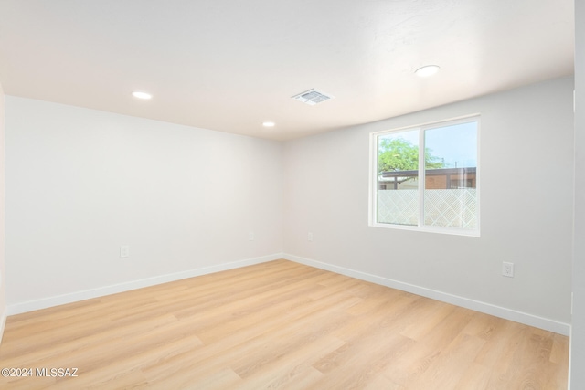 spare room with light hardwood / wood-style floors