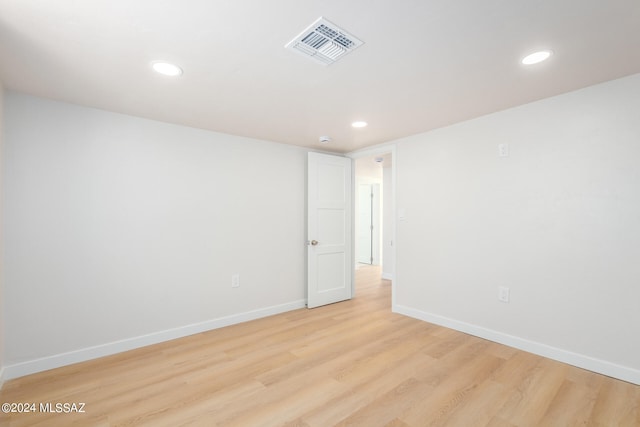 spare room featuring light hardwood / wood-style floors