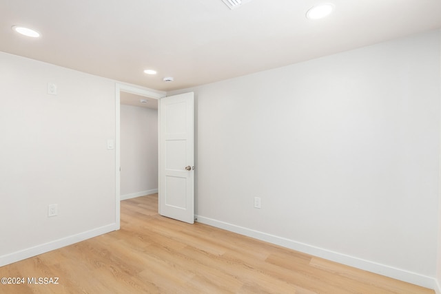 spare room featuring light hardwood / wood-style floors