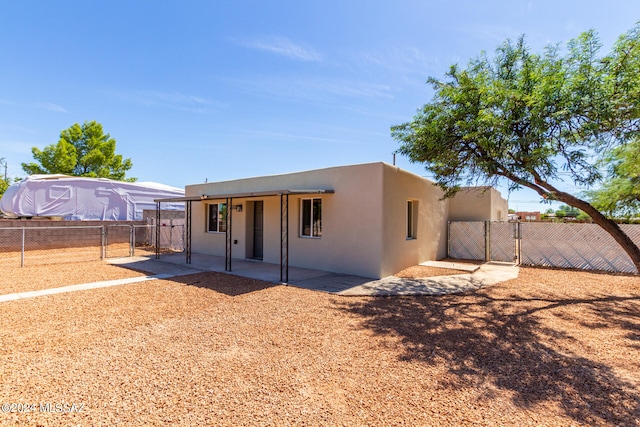 rear view of property with a patio area