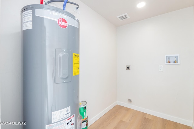 utility room featuring electric water heater