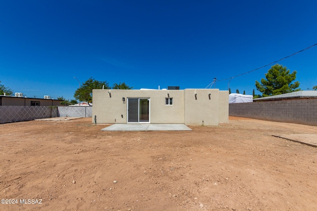 rear view of property with a patio