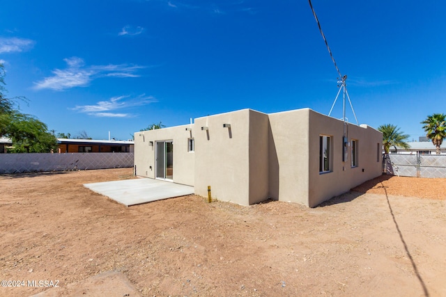 rear view of property with a patio