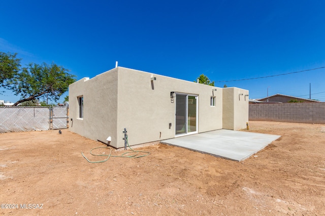 rear view of property with a patio area