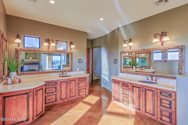 bathroom featuring vanity, tile patterned flooring, toilet, and plenty of natural light