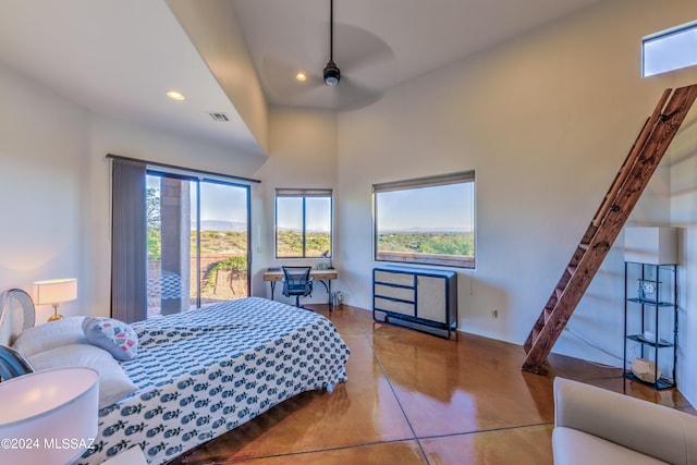 bedroom featuring multiple windows and ceiling fan